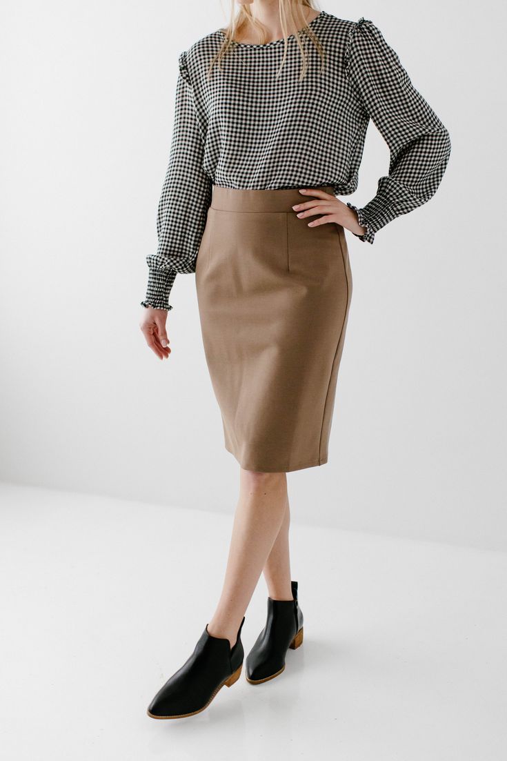 With clean, simple lines and sophisticated style, the 'Anna' is the perfect pencil skirt your closet has been waiting for. Quality fabric, full lining and structured style ensure a modest and flattering fit while an elastic waistband keeps you comfortable. Exclusively designed with you in mind! 68% Rayon 27% Nylon 5% Spandex Hand Wash Cold Separately or With Like Colors Do Not Bleach Hang to Dry Low Iron if Needed 1.75" Waistband Fully Lined Model Height 5'7" | Wearing Size Small in 24" Length P Spring Office Lady Skirt For Workwear, Office Lady Skirt For Spring Workwear, Midi Length Lined Skirt For Work, Workwear Midi Length Lined Skirt, Midi Length Bottoms For Office In Fall, Modern Fitted Mini Skirt For Work, Tailored Lined Pencil Skirt For Office, Classic Solid Color Skirt For Work, Office Wear Lined Pencil Skirt