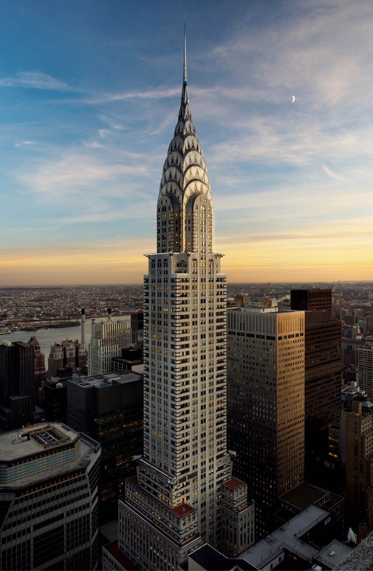 an aerial view of the chrysler building in new york city, ny at sunset or dawn