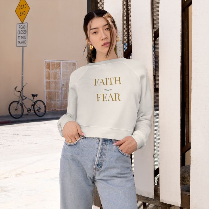 Wrap yourself in comfort and faith with our Faith over Fear graphic Sweatshirt. Made from a luxurious blend of Airlume ring-spun cotton and polyester fleece, this raglan pullover is incredibly soft and holds its shape perfectly. The contoured seams add a touch of style to this cozy sweatshirt. With its high-quality composition, it's ideal for sublimation printing, ensuring that the included design looks stunning. Embrace your faith with every wear. .: 52% Airlume preshrunk combed ring sun cotton, 48% polyester fleece .: Medium fabric (7.0 oz /yd² (240 g/m .: Mid-length .: Relaxed fit .: Tear-away label Childrens Clothes Boys, Womens Sweatshirts, Raglan Pullover, Pullover Fleece, Cut Sweatshirts, Cropped Tops, Cropped Sweatshirt, Looks Chic, Swimwear Girls