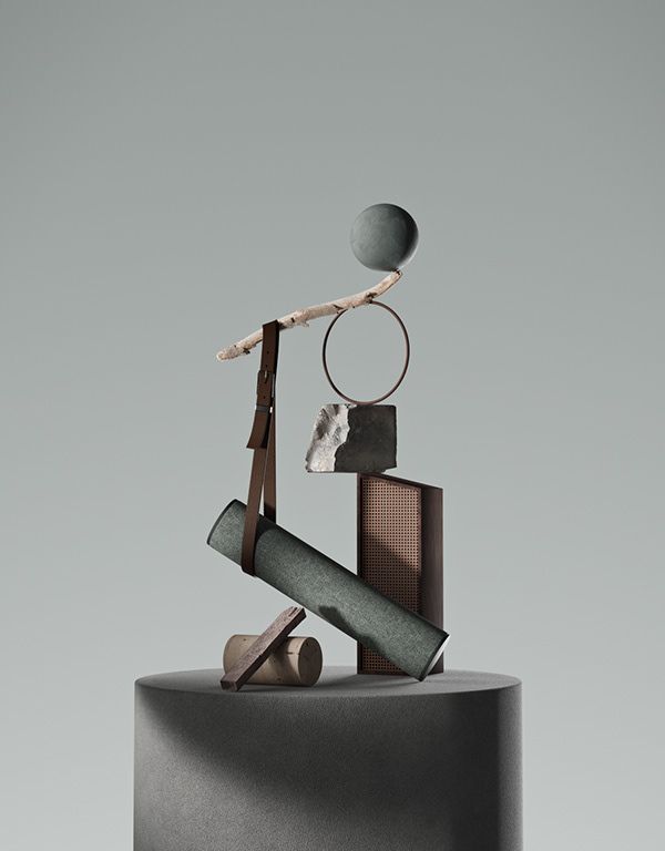 an abstract sculpture on top of a round black pedestal with a circular object hanging from it's side