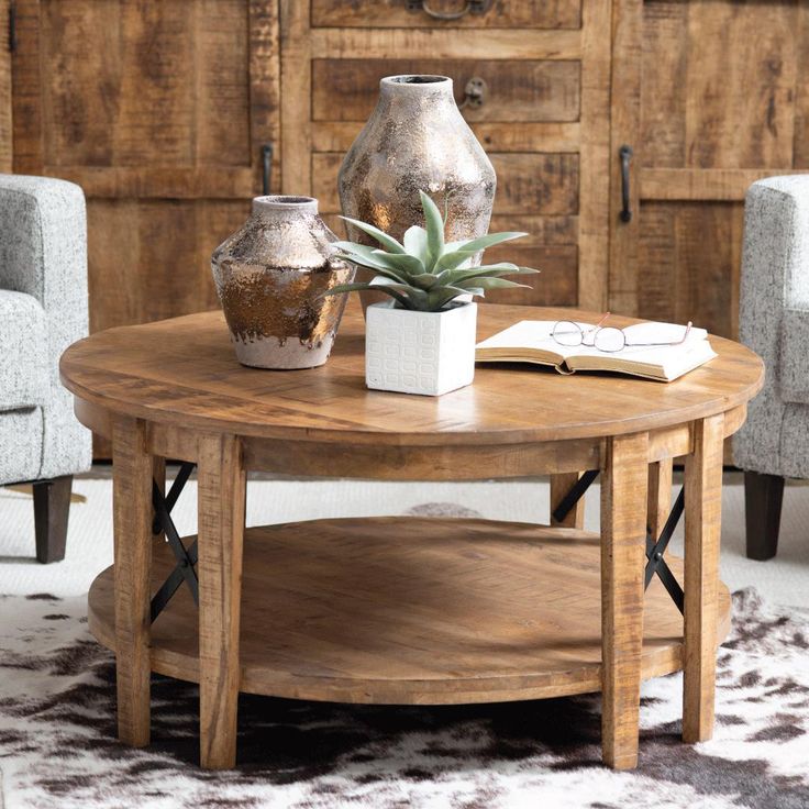 a wooden table with two vases on it