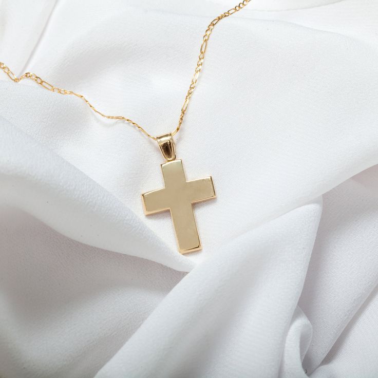 14K Solid Gold Christian Cross Pendant, with polished surface. A classic piece of jewelry ideal for a gift or baptism. All jewelry is made from 14 carat gold (14K) designed with particular craftsmanship. Match our jewelry with your personality and stand-out from the rest. Our world of jewels, your world of happiness! Baptism is called one of the seven ritual sacraments of the Christian churches using water as a symbol of purification, marking the introduction of the believer into the body of the Classic Crucifix Jewelry For First Communion, Silver Classic Jewelry For Baptism, Classic Cross Jewelry For Baptism, Classic Silver Jewelry For Baptism, Classic White Gold Cross Necklace For Anniversary, White Gold Polished Cross Necklace Gift, Classic White Gold Cross Necklace For Gift, White Gold Cross Necklace With Polished Finish As Gift, Classic 14k Gold Cross Necklace For Gift