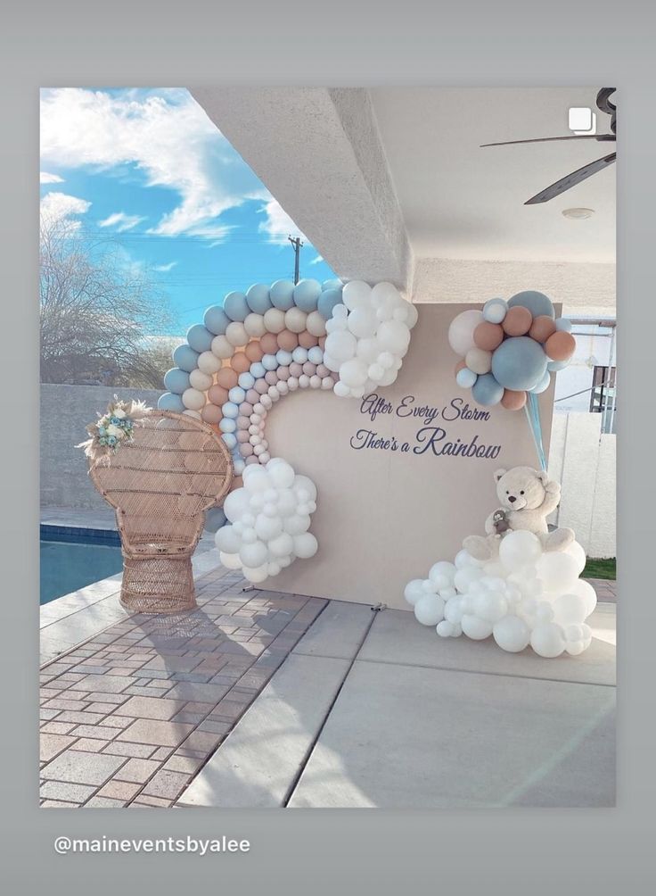 balloons and teddy bears are on display in front of a building