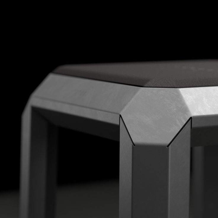 a close up of a metal table with black background