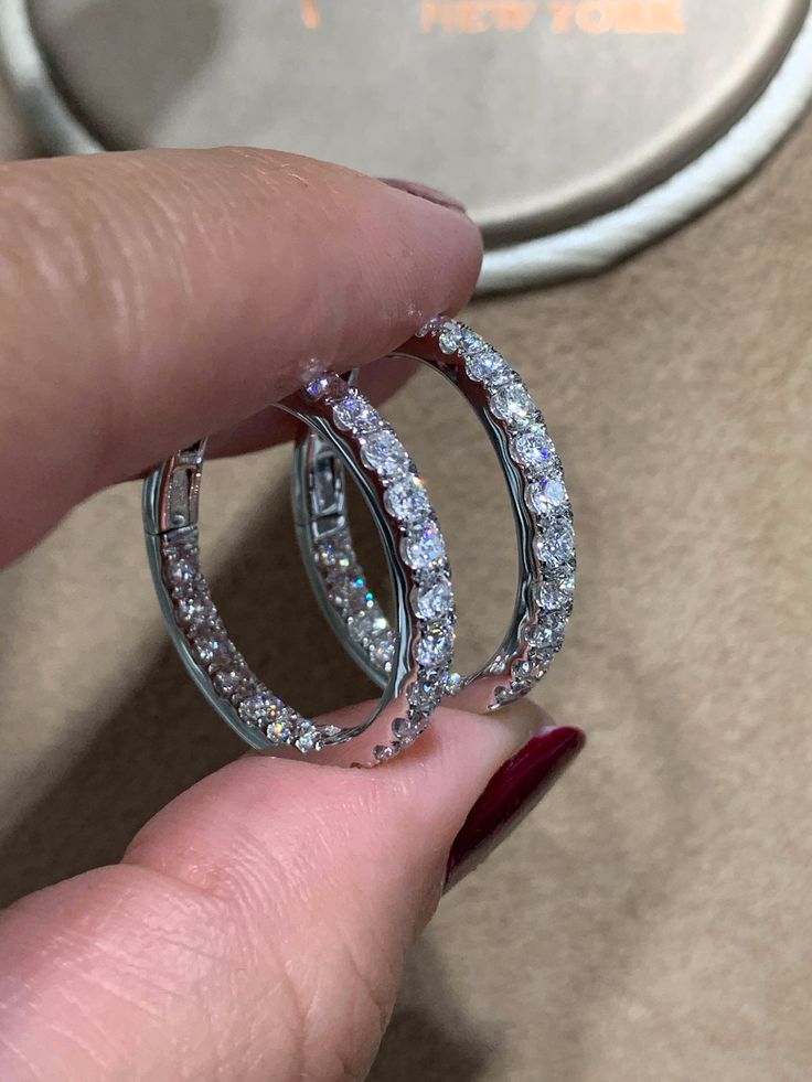 These diamond hoop earrings have been given a stylish touch with elegant round cut diamonds placed inside and out. 18Kt white gold hoop earrings are set with 2.48carats in round diamonds. Every woman can always use a pair of classic diamond hoop earrings to add to their wardrobe. Accessorize with these hoop earrings for fun and casual looks, or formal occasions where you want focus to be on your outfit.Metal: 18KT White GoldDiamond Weight: 2.48ct t.w.Diamond Shape: 38 RoundEarring Width: 3 mmEar Diamond Hoop Earrings With Halo Design, Round Diamond Hoop Earrings For Anniversary, Diamond Hoop Earrings With Brilliant Cut, Diamond Halo Design Hoop Earrings, Round White Gold Hoop Earrings With Halo Design, Hoop Diamond Earrings With Halo Design, Diamond Brilliant Cut Round Hoop Earrings, Diamond Hoop Earrings With Halo Design For Anniversary, Diamond Cut Hoop Earrings