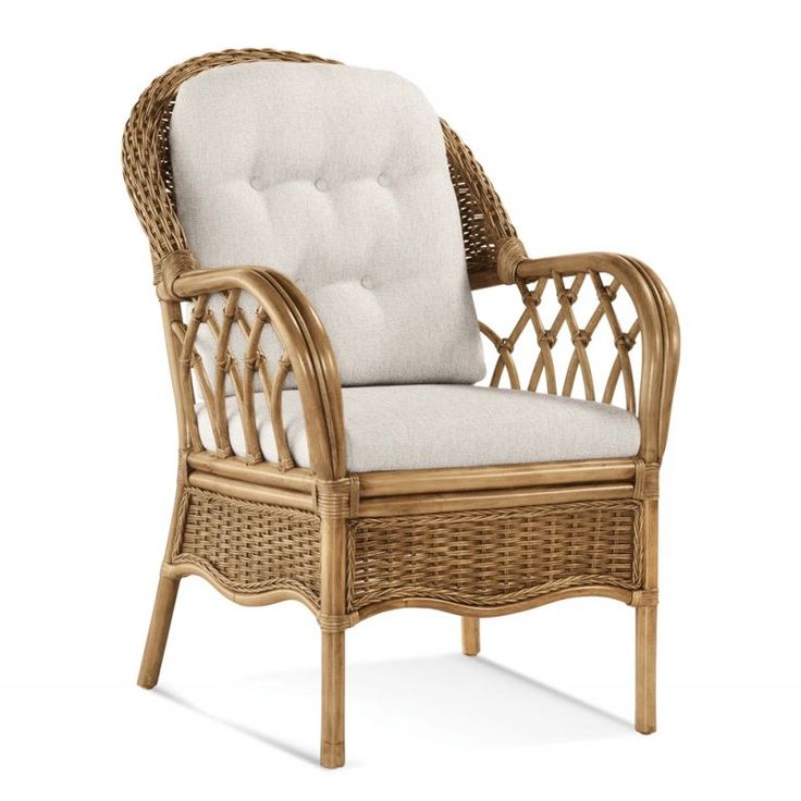 a wicker chair with a white cushion