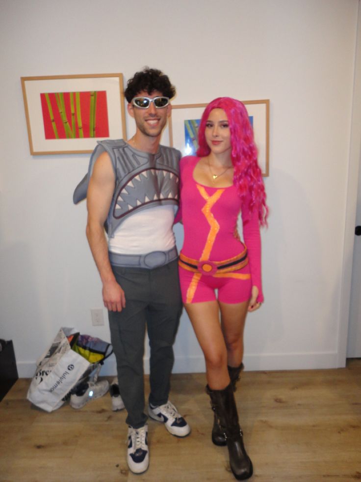 a man and woman dressed up in costumes