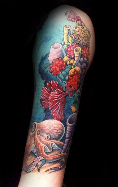 an octopus and flowers tattoo on the arm