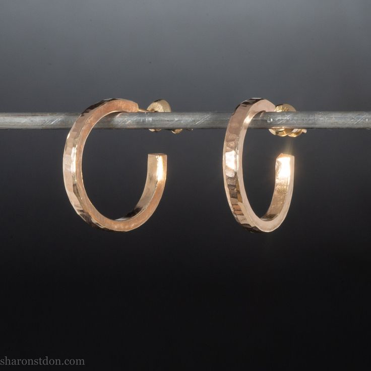 These solid 18k gold hoop earrings are handmade by me in the the Pacific Northwest of North America. Size: 18mm diameter. Approximately 2mm wide and 1.5mm thick. Locking solid 18k gold backs and posts. -GUARANTEED forever against breakage due to normal use. -Returns: I do not accept returns on gold earrings because I do not keep them in stock and need to order the gold. -Shipping: I will mail earrings within 7-10 business days and send fully insured with signature required. -Sustainability: I pu Handmade 14k Yellow Gold Huggie Earrings, Hand Forged Small Hoop Earrings For Anniversary, Minimalist Hammered Huggie Jewelry, Handmade Minimalist Yellow Gold Huggie Earrings, Minimalist Handmade Yellow Gold Huggie Earrings, Handmade 14k Gold Hoop Earrings For Everyday, Handmade Yellow Gold Round Huggie Earrings, Hammered Huggie Jewelry Gift, Handmade 14k Gold Round Huggie Earrings