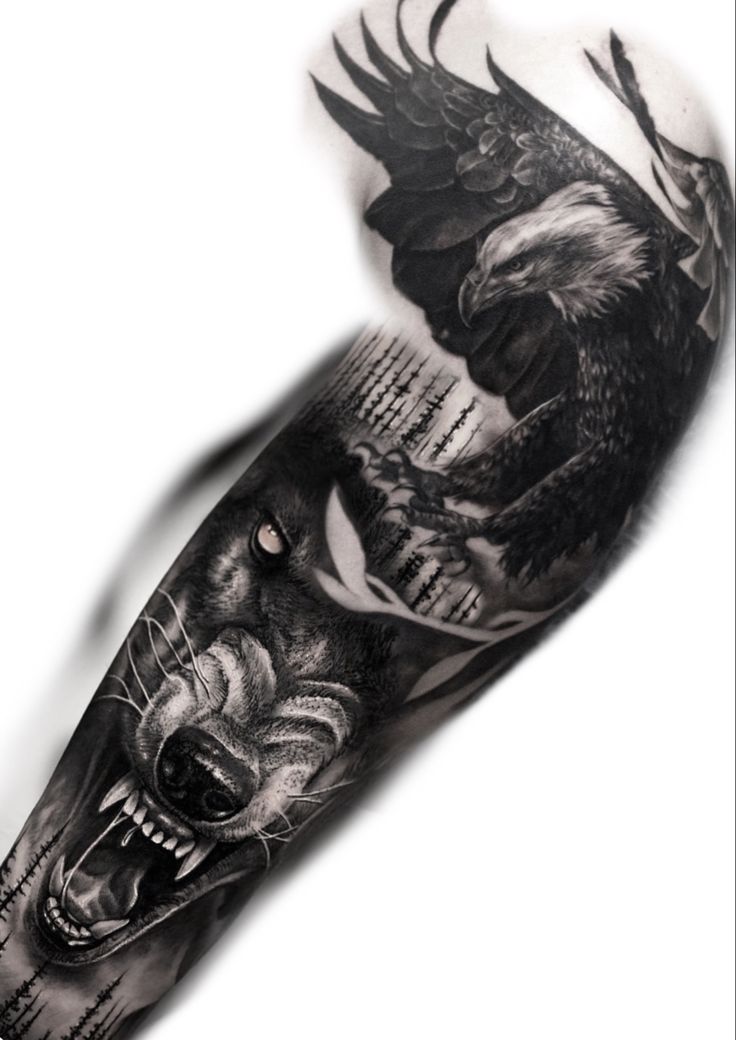 a black and white tattoo with an eagle and wolf on the left arm, next to another animal