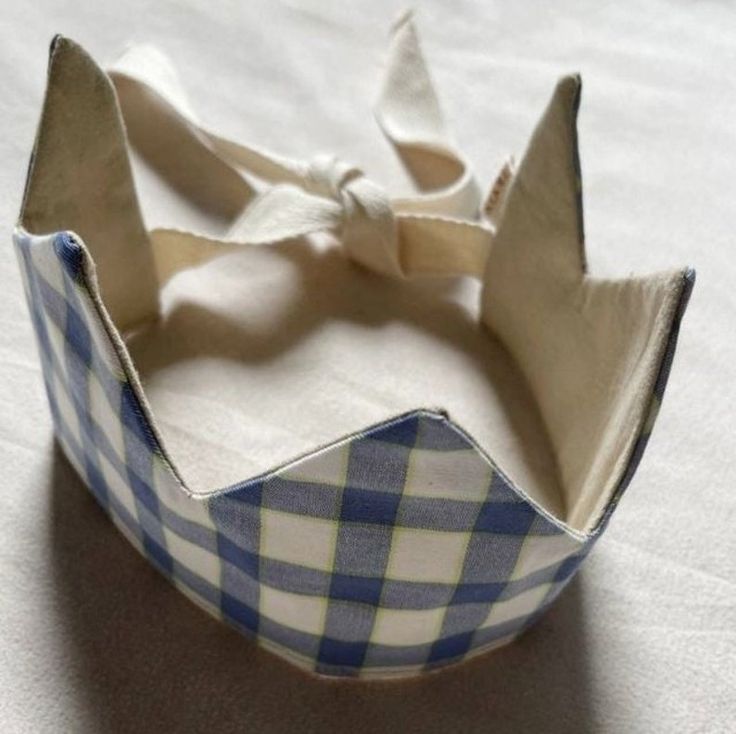 a blue and white checkered headband with a bow