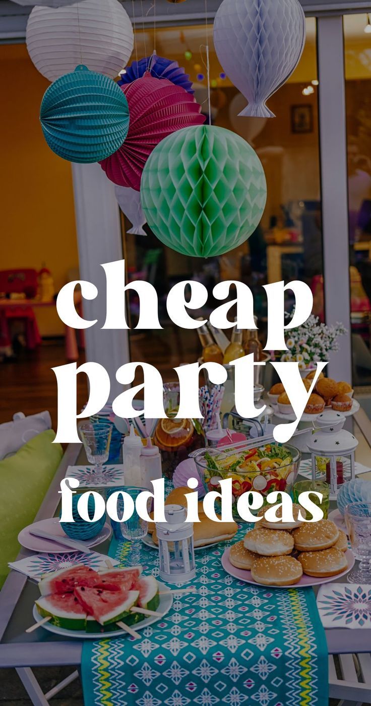 a table topped with lots of food and hanging paper lantern decorations that says cheap party food ideas