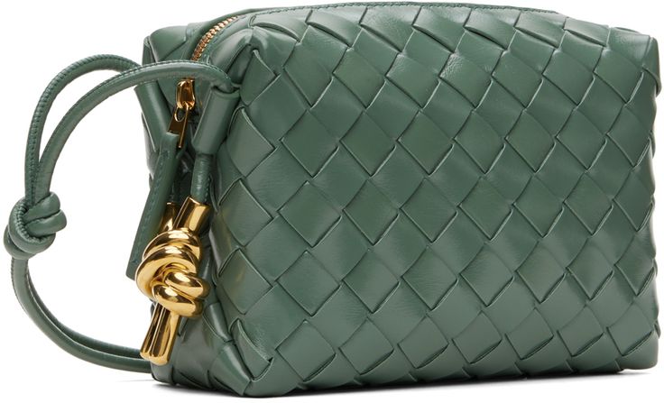 Intrecciato-woven polished calfskin crossbody bag in green. · Knotted accents at adjustable crossbody strap · Knotted hardware at sides · Zip closure · Bonded buffed calfskin lining · Gold-tone hardware · H4.5 x W6.5 x D2.5 Supplier color: Aloe muse brass Green Intrecciato Weave Crossbody Shoulder Bag, Green Woven Leather Formal Bag, Formal Green Woven Leather Bag, Green Formal Shoulder Bag With Intrecciato Weave, Formal Green Shoulder Bag With Intrecciato Weave, Green Intrecciato Weave Formal Shoulder Bag, Bottega Veneta Bags, Mini Crossbody Bag, Mini Crossbody