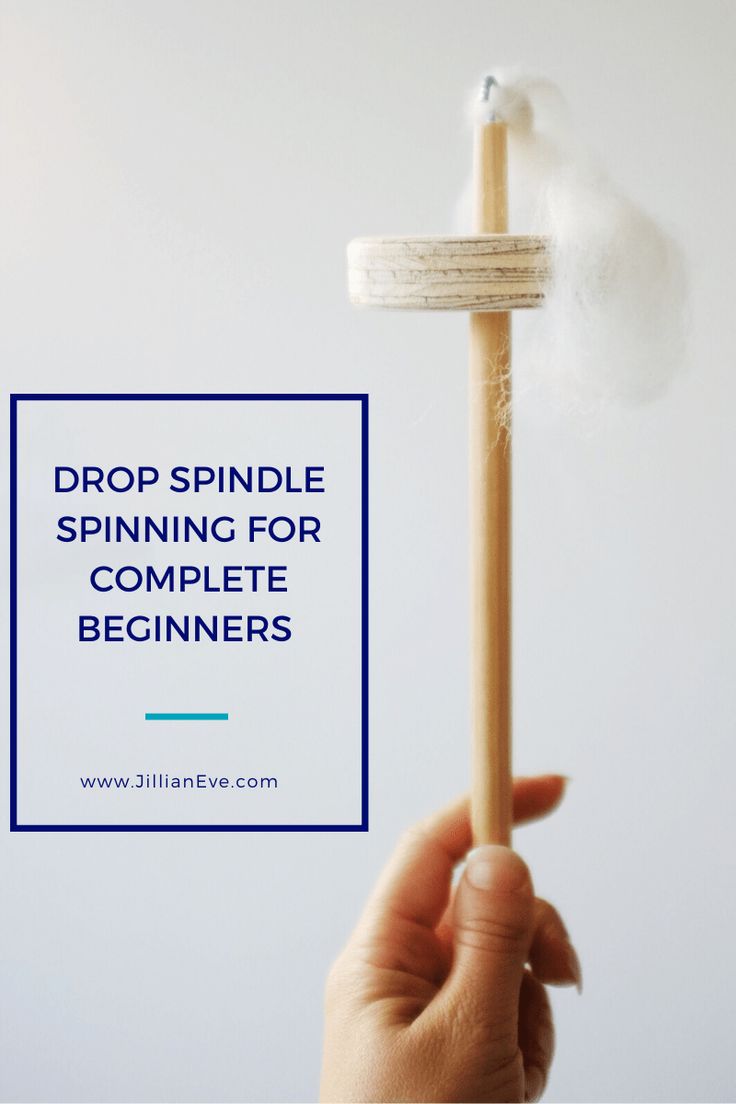 a person holding a stick with the words drop spindle spinning for complete beginners