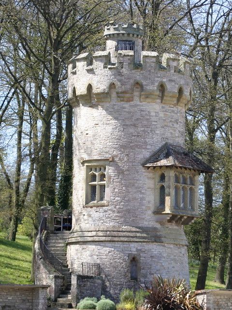 an old castle like building in the middle of a park