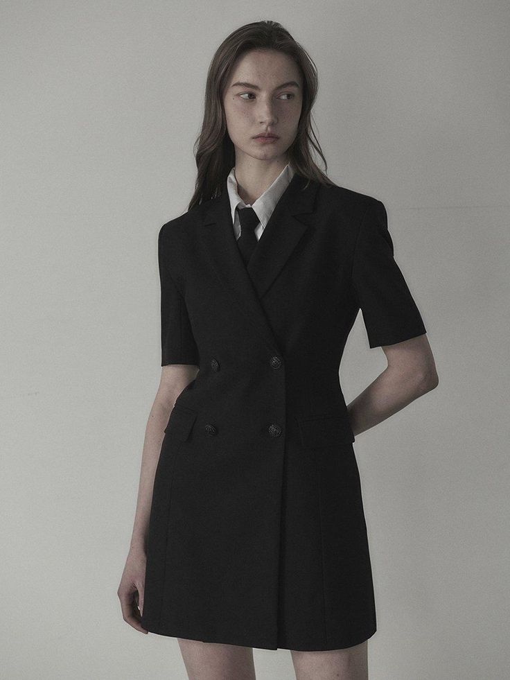 The slim fit jacket dress that made of lightweight spring fabric. Featuring the double-breasted closure with black-silver toned buttons, and its slim silhouette and mini length. We recommend style with shirts or scarf to create unique school look. - Notched lapel collar and half-sleeved design- Double-breasted closure- Black-silver buttons detail- Flap pockets and seam line detail at front- Slim and fitted silhouette, mini length- Lightweight polyester fabric for spring- Renewed slim fit version of previous 'Jenn Suit Jacket Dress' Tailored Mini Length Jacket Dress For Formal Occasions, Tailored Blazer Dress With Suit Collar For Office, Tailored Classic Jacket Dress For Semi-formal Occasions, Elegant Tailored Mini-length Blazer, Tailored Mini Jacket Dress For Semi-formal Occasions, Winter Semi-formal Single Breasted Blazer Dress, Elegant Mini Length Jacket Dress For Formal Occasions, Elegant Mini Jacket Dress For Formal Occasions, Black Notch Lapel Business Dress