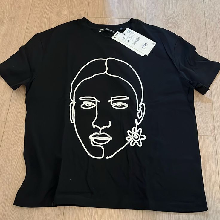 Zara Graphic Face Tee. Brand New With Tags. Purchased In Europe. Zara Black Tops For Streetwear, Black Zara Tops For Streetwear, Zara Black T-shirt For Spring, Chic Summer Graphic Print T-shirt, Chic Zara T-shirt With Crew Neck, Black Zara T-shirt For Summer, Trendy Black T-shirt By Zara, Trendy Zara T-shirt With Graphic Print, Cute Zara T-shirt With Graphic Print