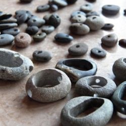 several different types of stone beads on a table