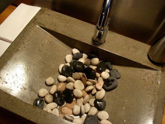 a knife and some rocks in a sink