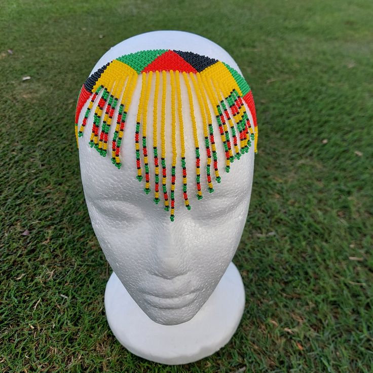 100 % Handmade with fine beads. One size fits most, Beaded Zulu tassel necklace that can also be worn as a head band. The band is multicolored and the tassel has a solid color with a finish of different colors. We have five solid colors for the tassel, Red, Orange, Blue, white and yellow. Made in South Africa, Durban. Zulu Head Beads, Tassel Headband, Zulu Women, Beaded Headband, Durban, Colour Star, Head Band, Zulu, Beaded Chain