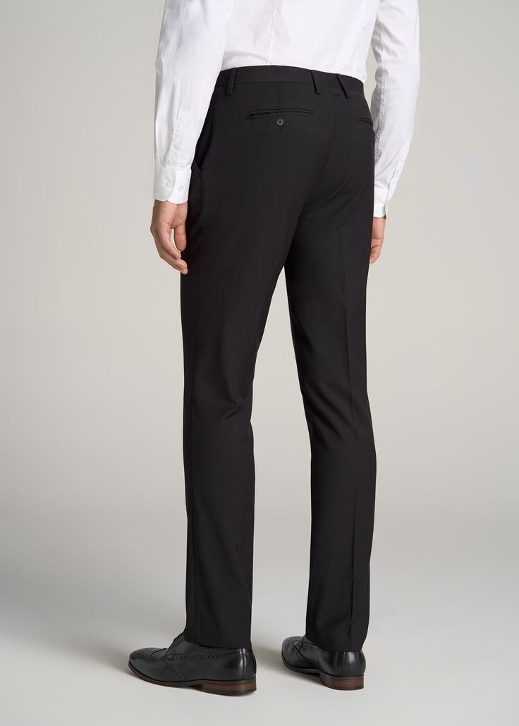 About Our Suit Trousers for Tall Men Crisp, classic and comfortable. That’s what you’ll find in these suit trousers for tall men. Thoughtfully designed for men from 6’ to 7’1, these pants have an extended inseam for longer legs without the extra bagginess you usually find in a longer pant. They’re made with a slightly stretchy polyester blend and feature a comfortable cotton-blend lining. These men’s tall pants feature a tailored fit for a modern look that’s easy to wear from the office to the e Yacht Uniform, Black Formal Pants, Men's Black Suit, Black Suit Trousers, Jeans Outfit Men, Longer Legs, Black Suit Men, Tall Men, Fitted Dress Pants