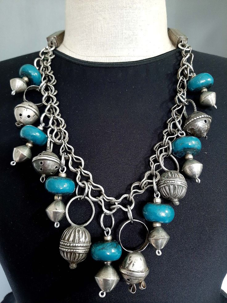 "Vintage Moroccan tribal ethnic Berber Tuareg silver hair ring pendants + blue resin bead pendants on Fibula chain necklace. Lovely tribal ethnic Berber beads necklace from Morocco. There are 6 old silver Berber hair rings, those were worn in the past braided into the women's hair, and 7 blue resin on bi-coned beads pendants all strung on a silver woven link fibula chain. The neck piece is a black cotton Moroccan rope with silver fibula endings. This necklace truly is spectacular you will love i