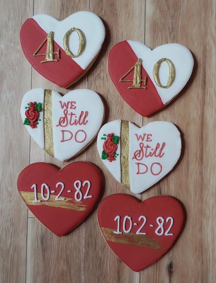 four decorated heart shaped cookies with the number forty one two three