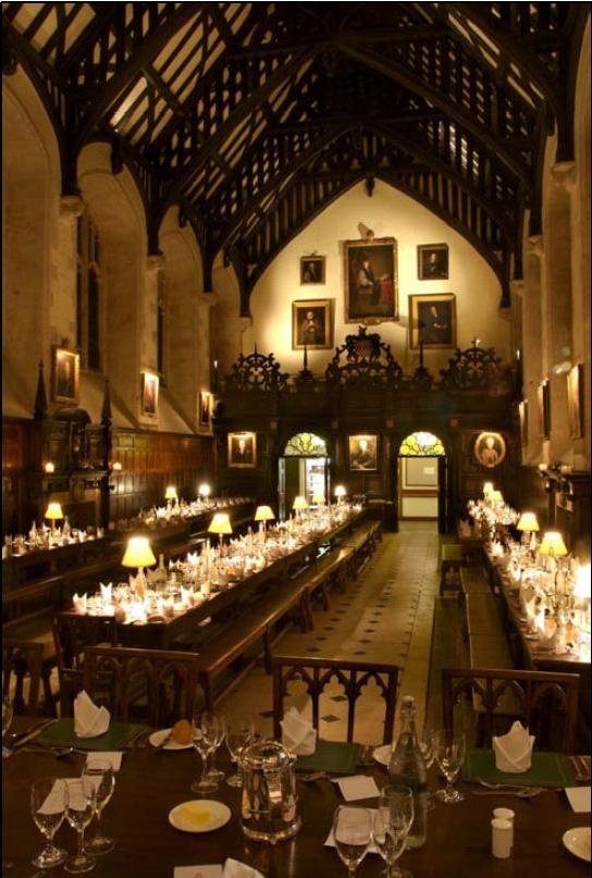 a large dining hall with tables and chairs set up for an event in the center