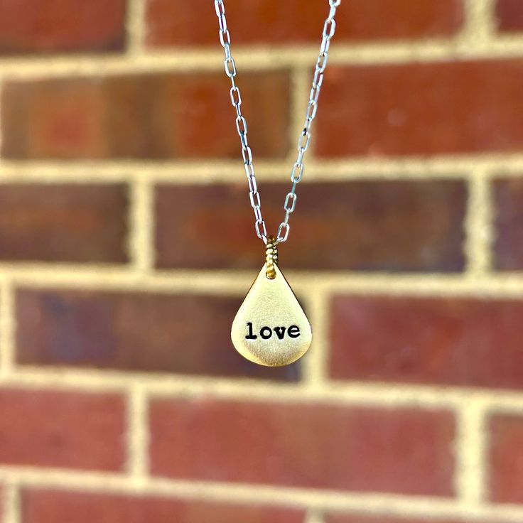 Handmade to hold a word that will encourage you and uplift you in this season, this dainty necklace is an inspiring way to keep hope and meaning close. When you order a Heaven Inspired piece, we pray over the name you include with your order and ask the Lord for a word that He's speaking over you (or the name of the person you're gifting). We then design your piece with a hand-stamped surprise word based on what we heard. This piece includes a personalized card explaining what we heard for you. Everyday Spiritual Charm Necklace With Round Pendant, Everyday Meaningful Nickel-free Charm Necklaces, Adjustable Teardrop Pendant Charm Necklace For Everyday, Spiritual Pendant Charm Necklace For Everyday, Handmade Brass Charm Necklaces For Everyday, Everyday Handmade Brass Charm Necklaces, Handmade Brass Charm Necklace For Everyday, Teardrop Pendant Charm Necklace With Adjustable Chain As Gift, Teardrop Pendant Charm Necklace As Gift