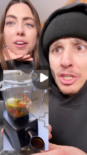 a man and woman are looking at the camera while making food in a blender