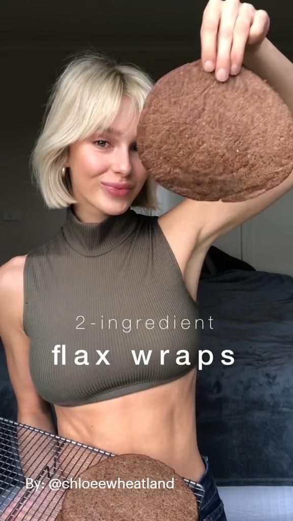 a woman is holding a large piece of chocolate cake in front of her face with the caption, 2 ingredient flax wraps