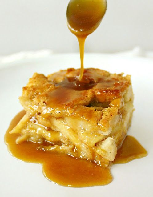 a spoon drizzling caramel sauce onto a piece of food on a white plate