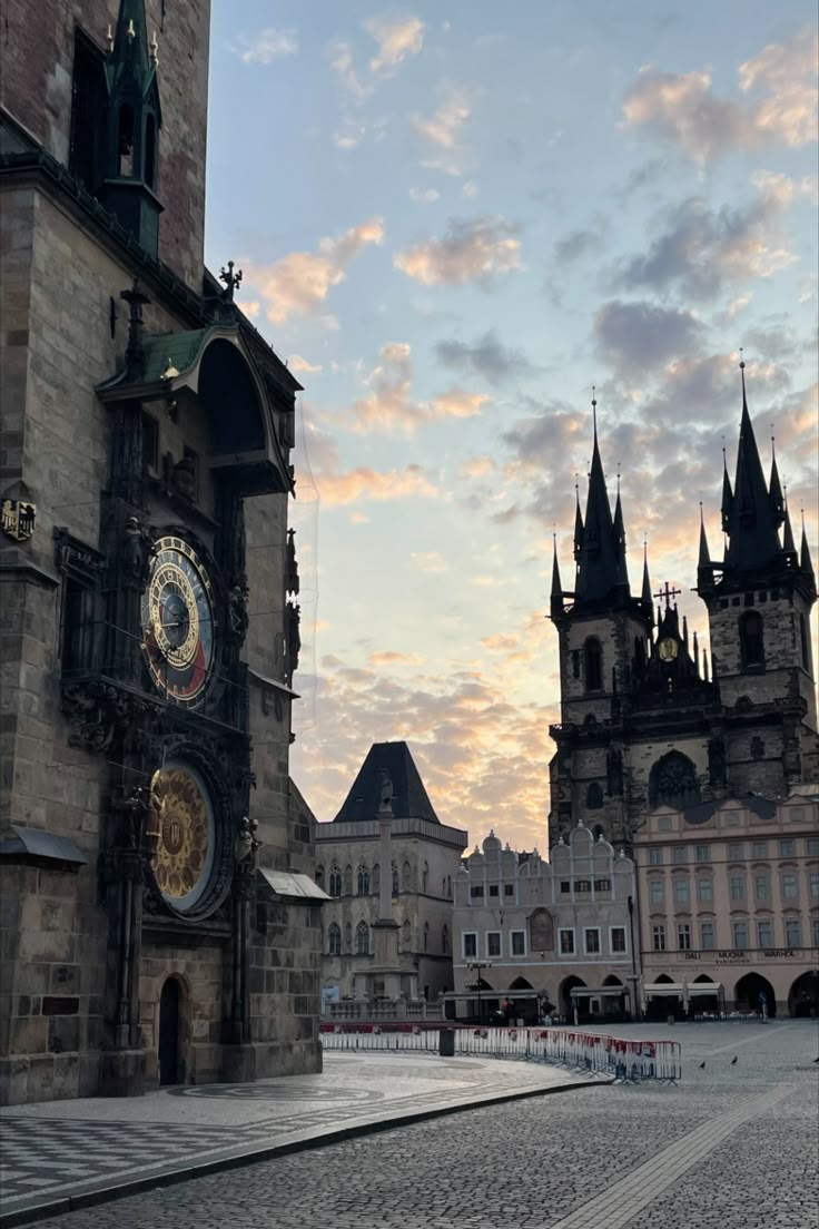 an old building with clocks on the side of it