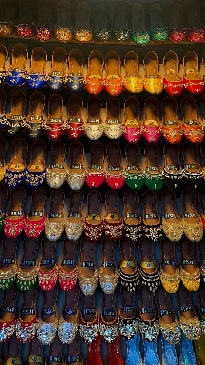 many pairs of shoes are on display for sale