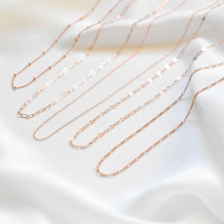 "A light and dainty, single chain necklace made of all 14K rose gold filled materials. Choose the chain style you like and customize the length. For half inch or extra short/long chains, simply leave a note at checkout. 14K Rose Gold-filled, tarnish-resistant, and water-resistant. Lengths 13 inches and under will come with an additional 2 inch extension meaning you can adjust the necklace to be lengths 13 - 15 inches so you can be confident it'll fit your neck perfectly and comfortably. You can Minimalist Rose Gold Link Necklace, Rose Gold Minimalist Cable Chain Necklace, Minimalist Rose Gold Cable Chain Necklace, Minimalist Rose Gold Chain Link Necklace, Everyday Delicate Rose Gold Chain Necklace, Rose Gold Link Chain Necklace With Paperclip Chain, Rose Gold Cable Chain Necklace For Everyday, Everyday Rose Gold Cable Chain Necklace, Rose Gold Oval Link Chain Necklace As Gift