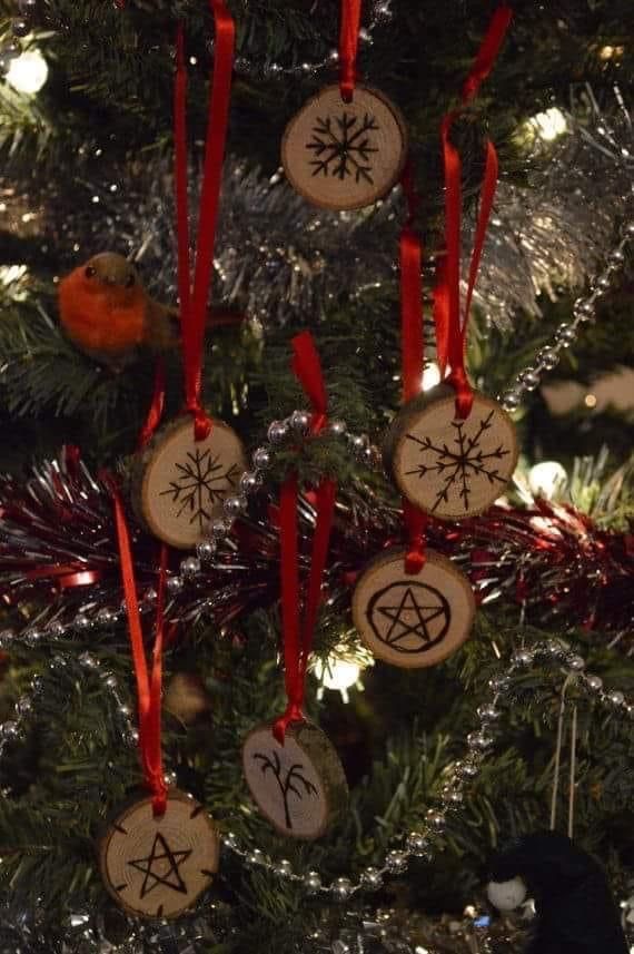 a christmas tree with ornaments hanging from it