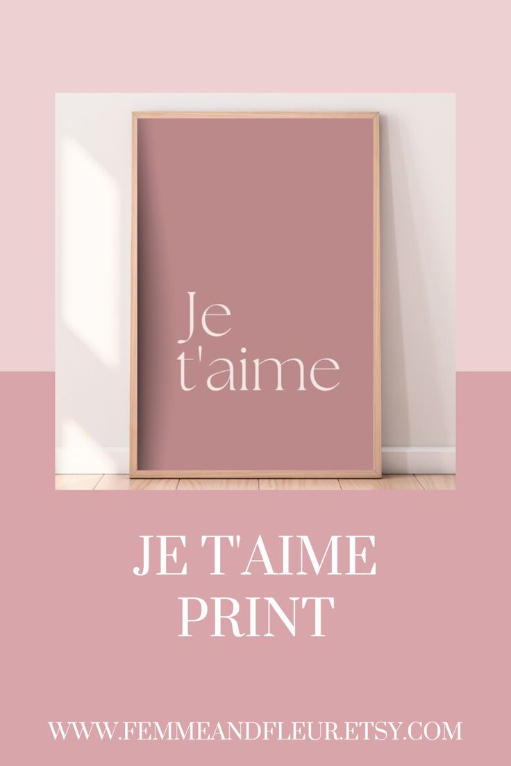 a pink frame with the words je t'aime print in white on it