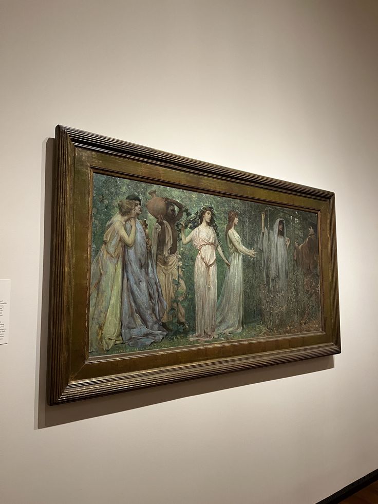 a painting hanging on the wall in a museum