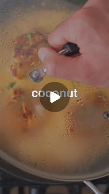 someone is cooking food in a pan with the words coconut oil on it, and there are