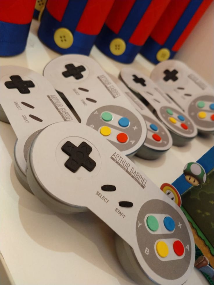 several video game controllers sitting on top of a table