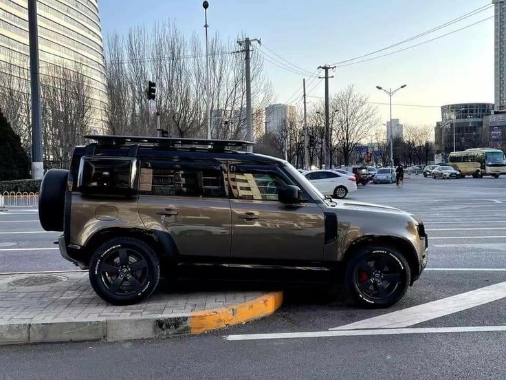 an suv is parked in the middle of a parking lot