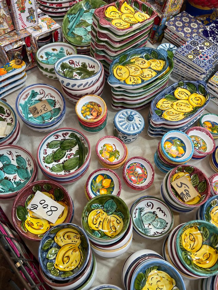 many plates and bowls are on the table