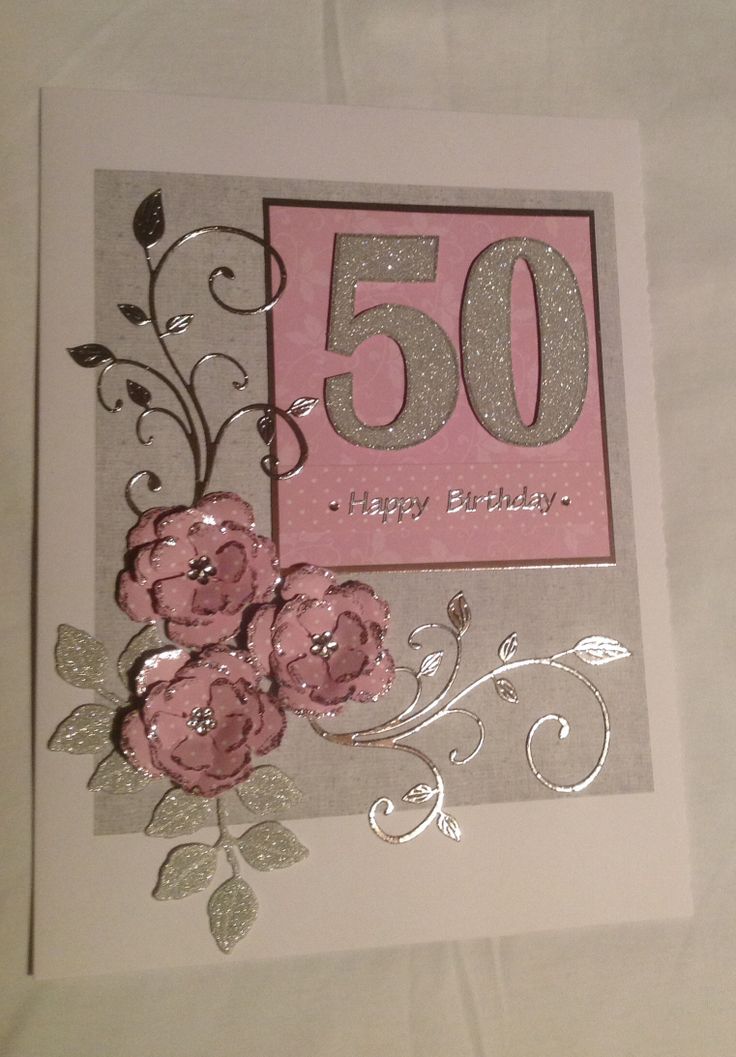 a pink and silver 50th birthday card with flowers