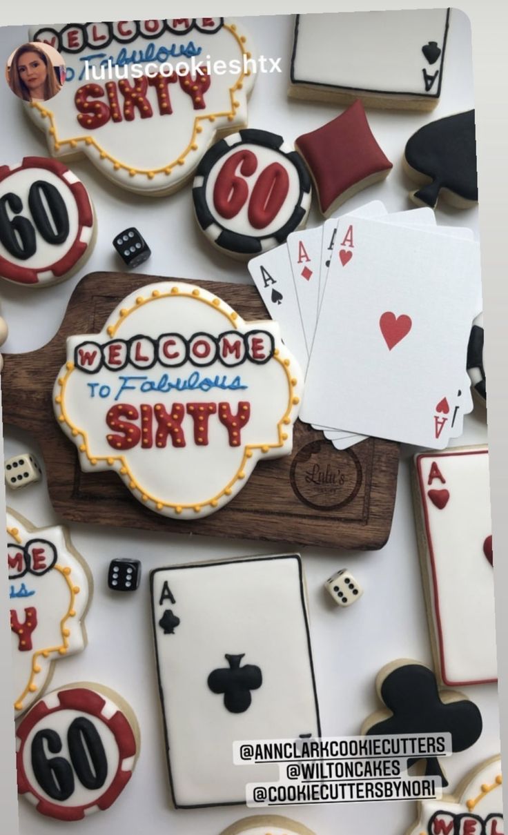 some cookies and playing cards are arranged on a white table top with the words welcome to sixty