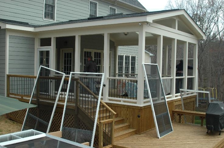 a house with screened porch and grilling area