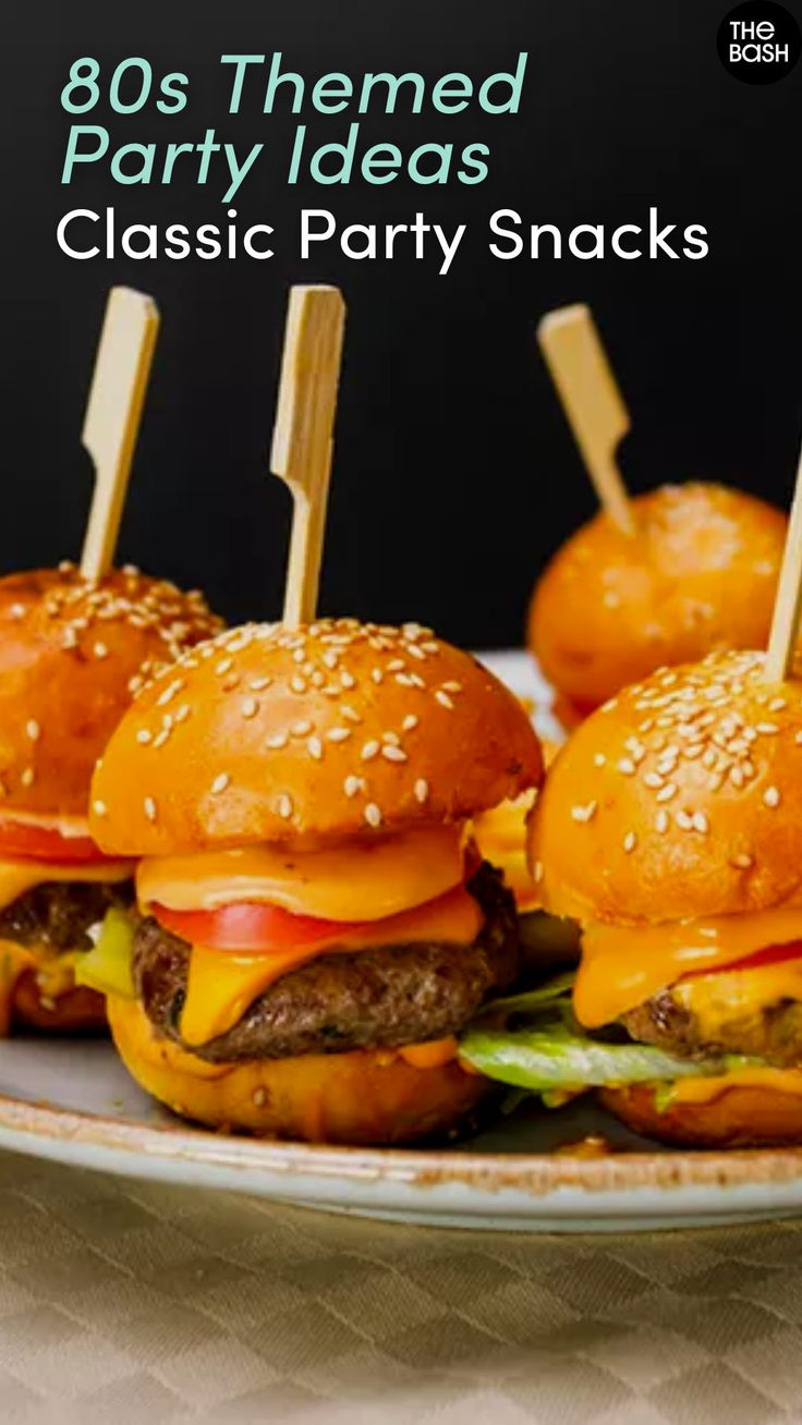 there are hamburgers with toothpicks stuck in them on a plate that says, 80's themed party ideas classic party snacks