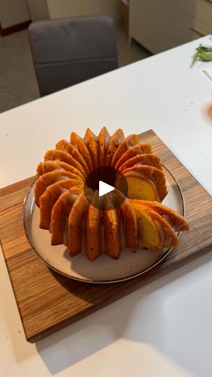 a bundt cake sitting on top of a wooden cutting board