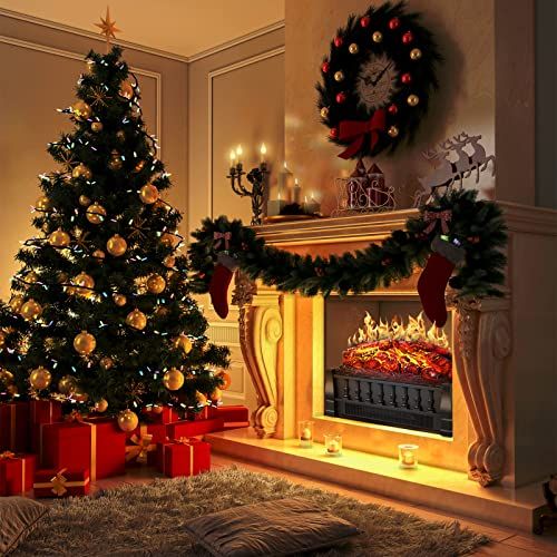 a decorated christmas tree in front of a fireplace