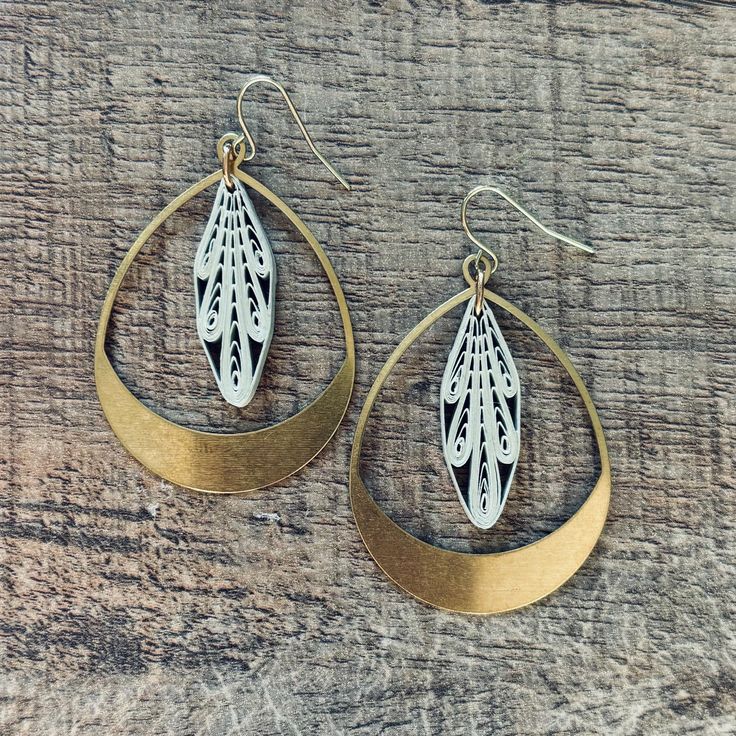 These gorgeous dangle earrings are hand made by the artist using paper, brass findings, and ear wires. They are sealed with a special sealant so they hold their shape and are durable enough for every day wear. Handmade Brass Teardrop Earrings, Artisan Teardrop Nickel Free Earrings, Artisan Teardrop Nickel-free Earrings, Bohemian Bronze Teardrop Earrings Gift, Vintage Brass Teardrop Earrings, Brass Teardrop Earrings With French Hook, Nickel-free Brass Dangle Teardrop Earrings, Nickel Free Brass Teardrop Dangle Earrings, Nickel Free Brass Dangle Teardrop Earrings