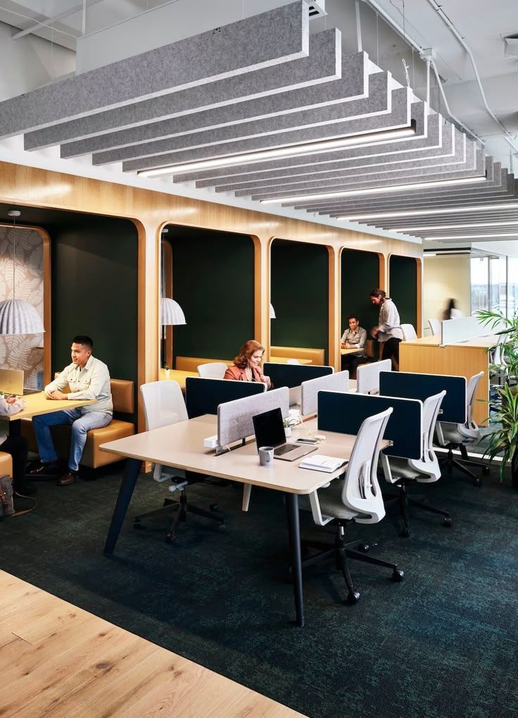 people sitting at desks in an office setting